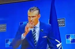 Pete Hegseth Drinking at Podium